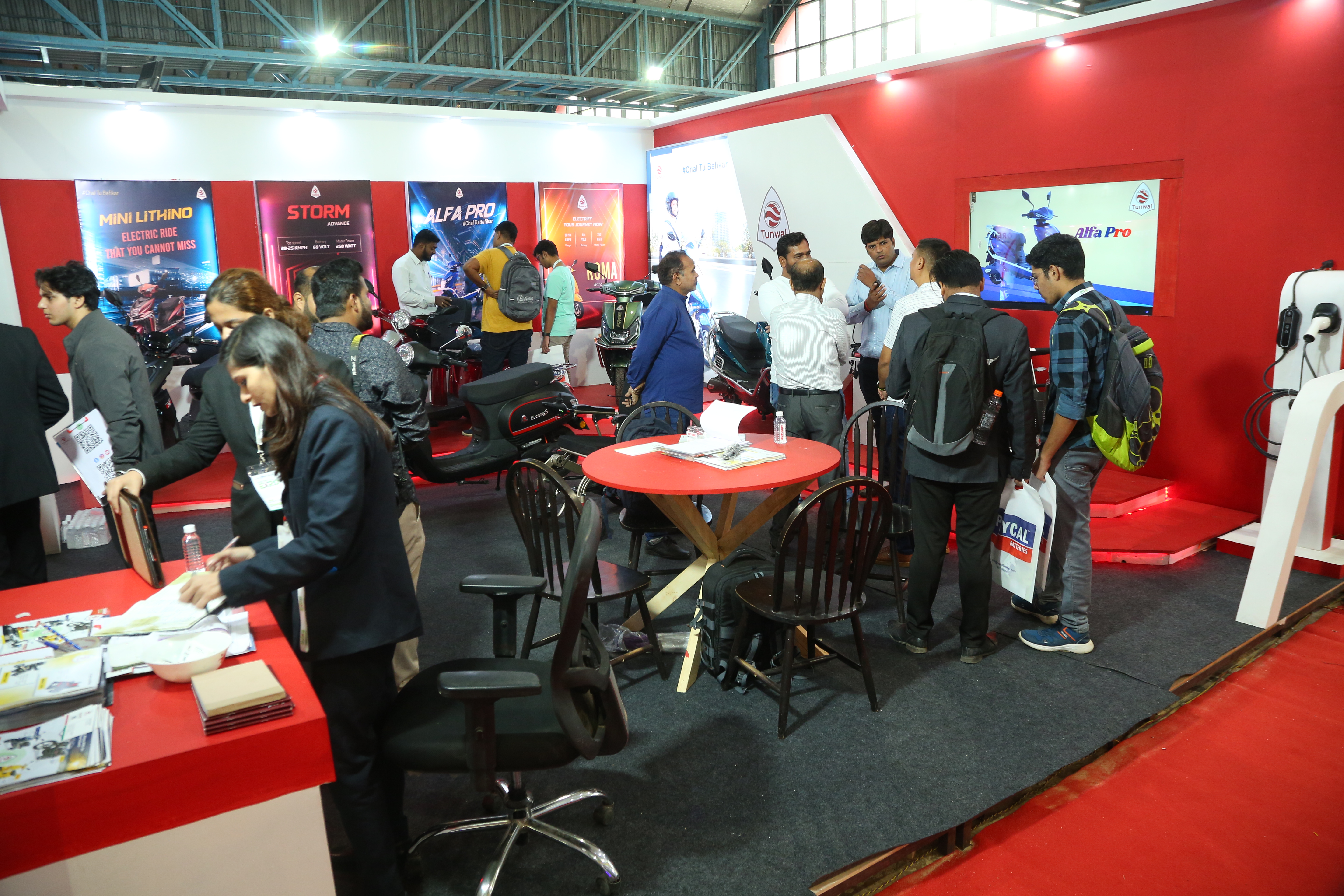 EV product showcase and visitor discussions at Maha Expo